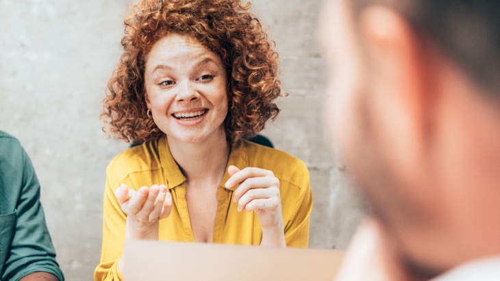 Smiling woman in meeting
